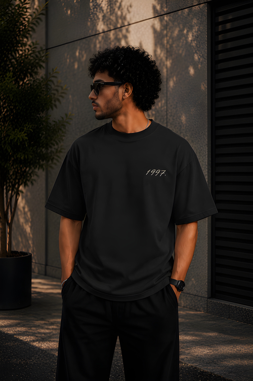Antim 1997 Oversized Black Drop Shoulder T-Shirt Front View Male Model Streetwear India