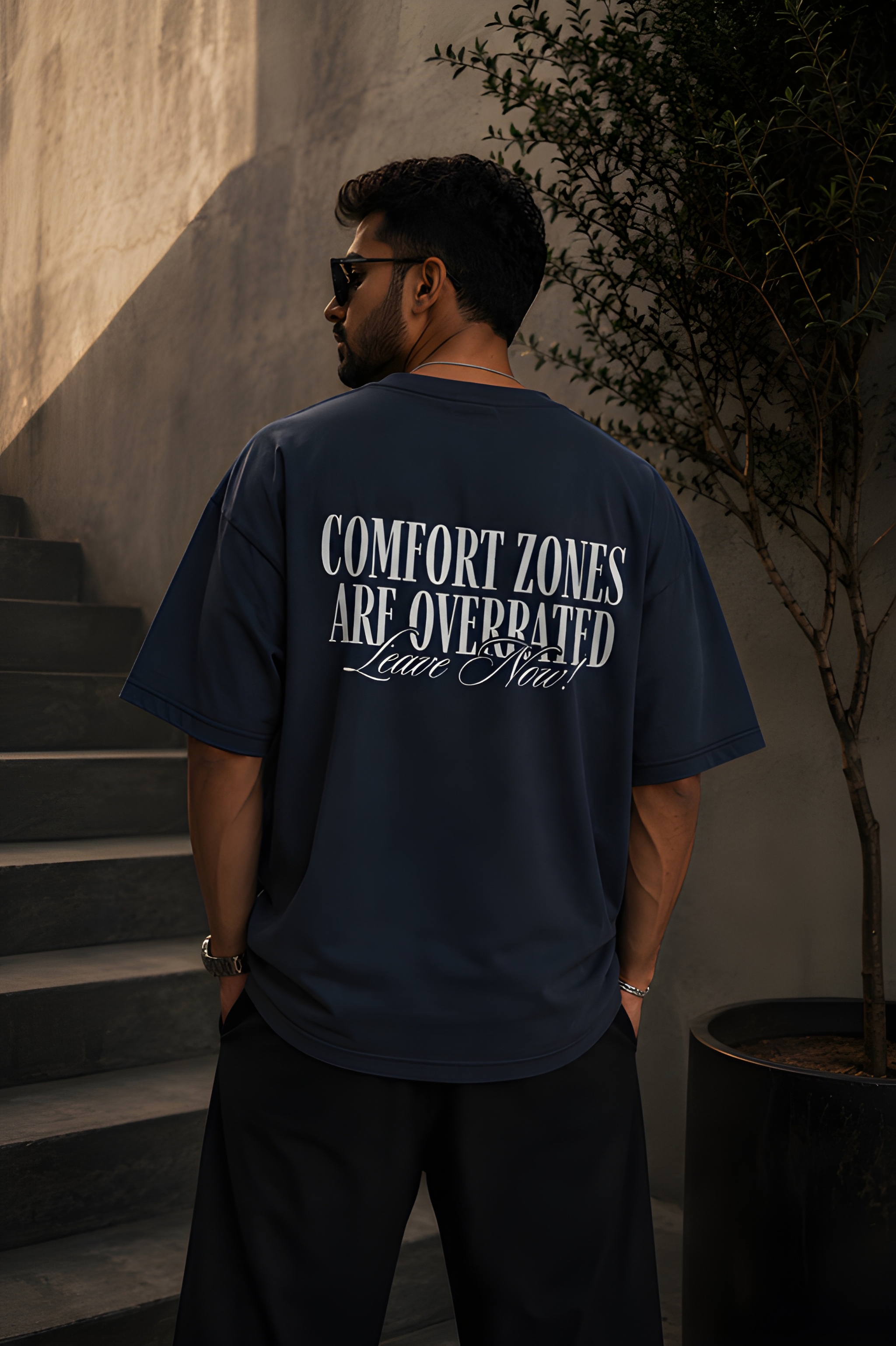 Antim Comfort Zones Are Overrated Oversized Navy Blue T-Shirt Bold Back Typography Print Drop Shoulder Male Model Outdoor Streetwear India