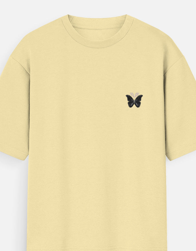 Antim Spread Kindness Like Wildflowers Oversized Beige T-Shirt Butterfly Chest Detail Front Flat Lay Minimal Streetwear India
